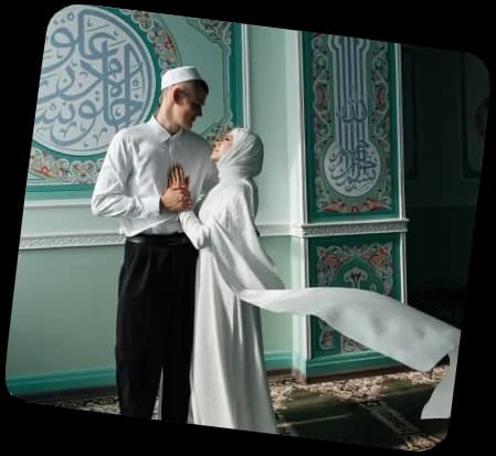 A couple standing in front of a mosque